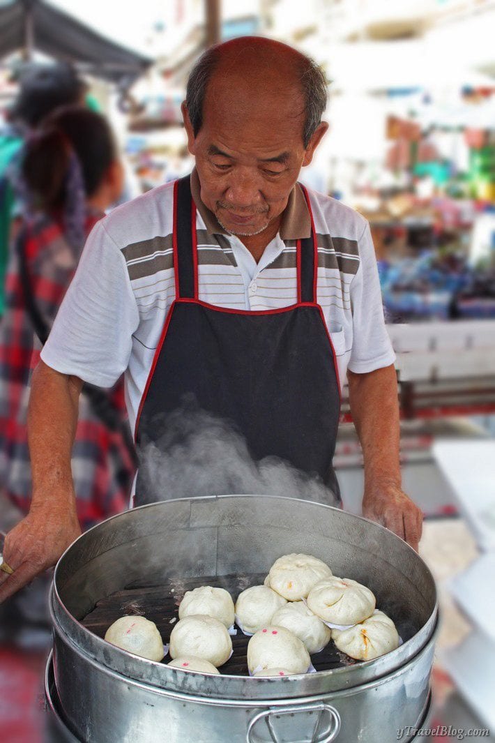 Chinatown food vendor making dumplings