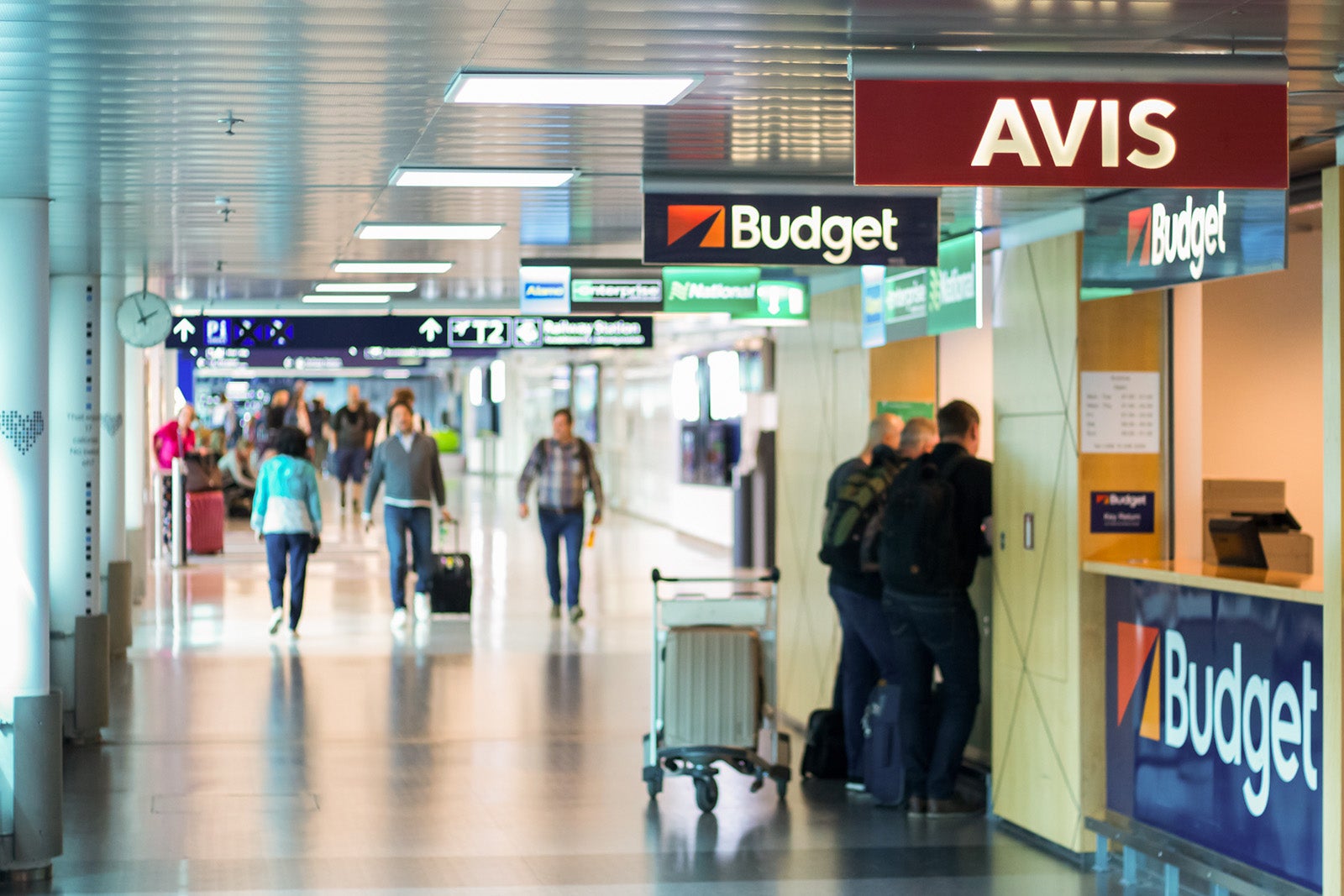 Car rental agencies in Helsinki Airport - Blurred people waitin on the the desk