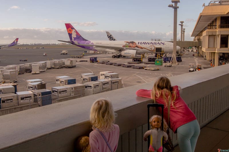 girls looking at airplane