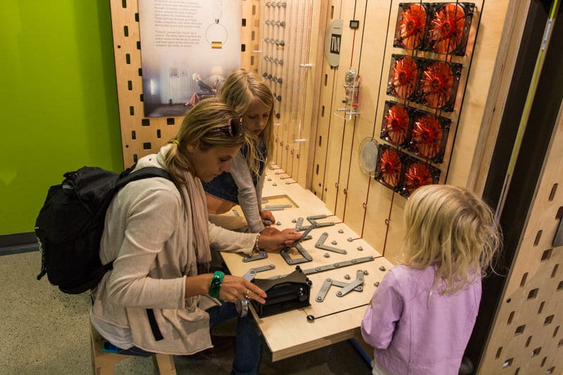 woman and girls interacting with exhibits at The Muse, Knoxville