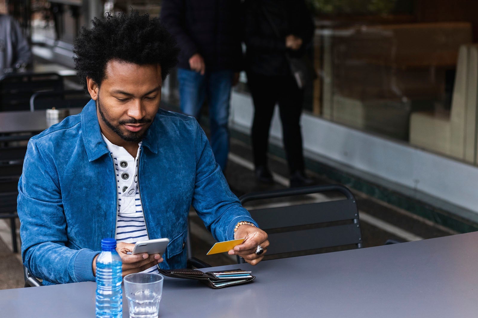 Man looking at credit card