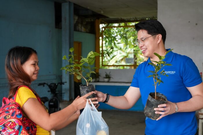 Parent of a young scholar of Project PEARLS received a Sampaguita seedling.
