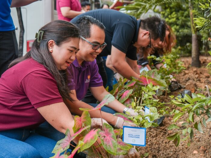 Megaworld Hotels & Resorts representatives planting some Sampaguita seedlings near Project PEARLS Learning Center.