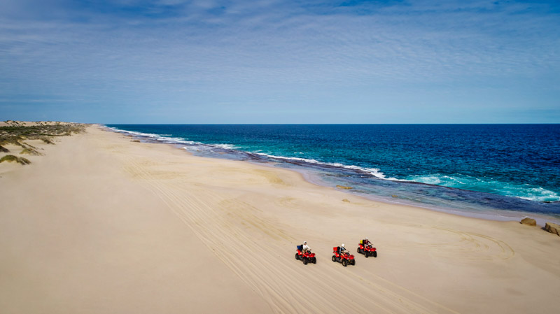 peopel riding Quad Bike riding on Wagoe Beach, near Kalbarri