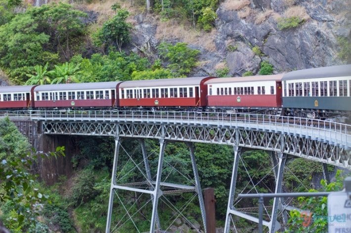 A train crossing a bridge over a river