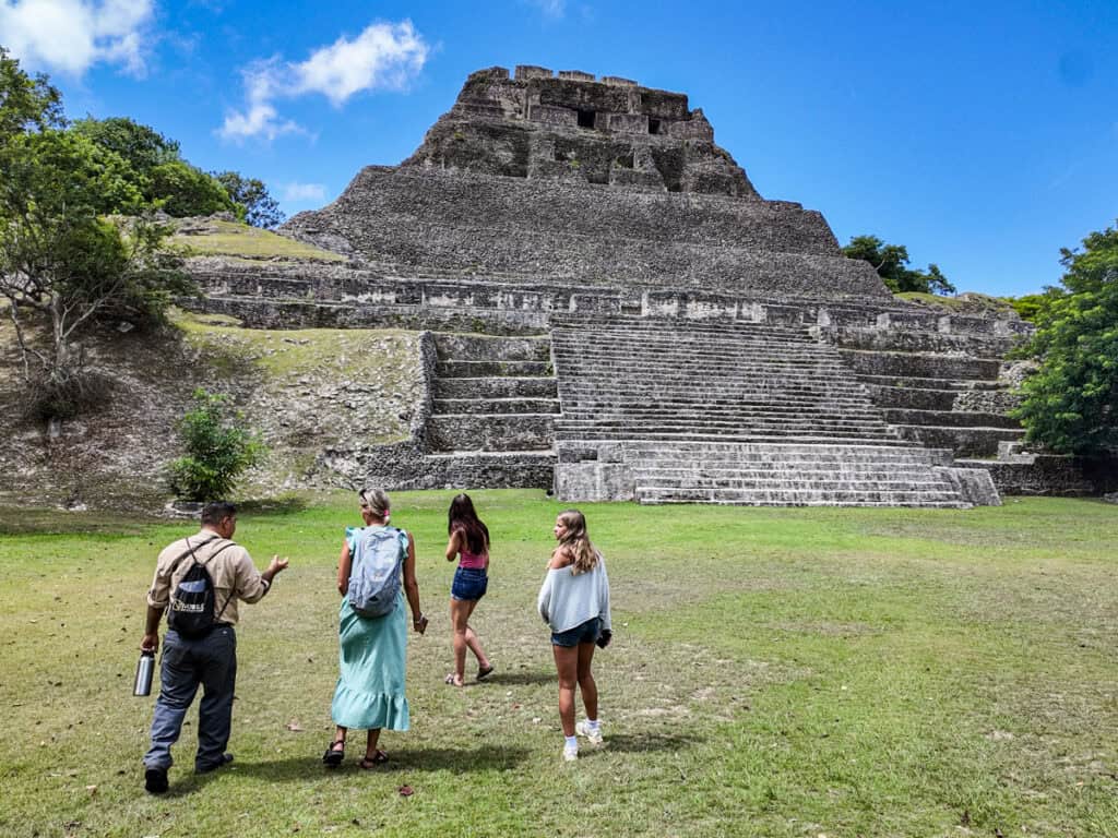 guide with tour group at bottom of el castillo
