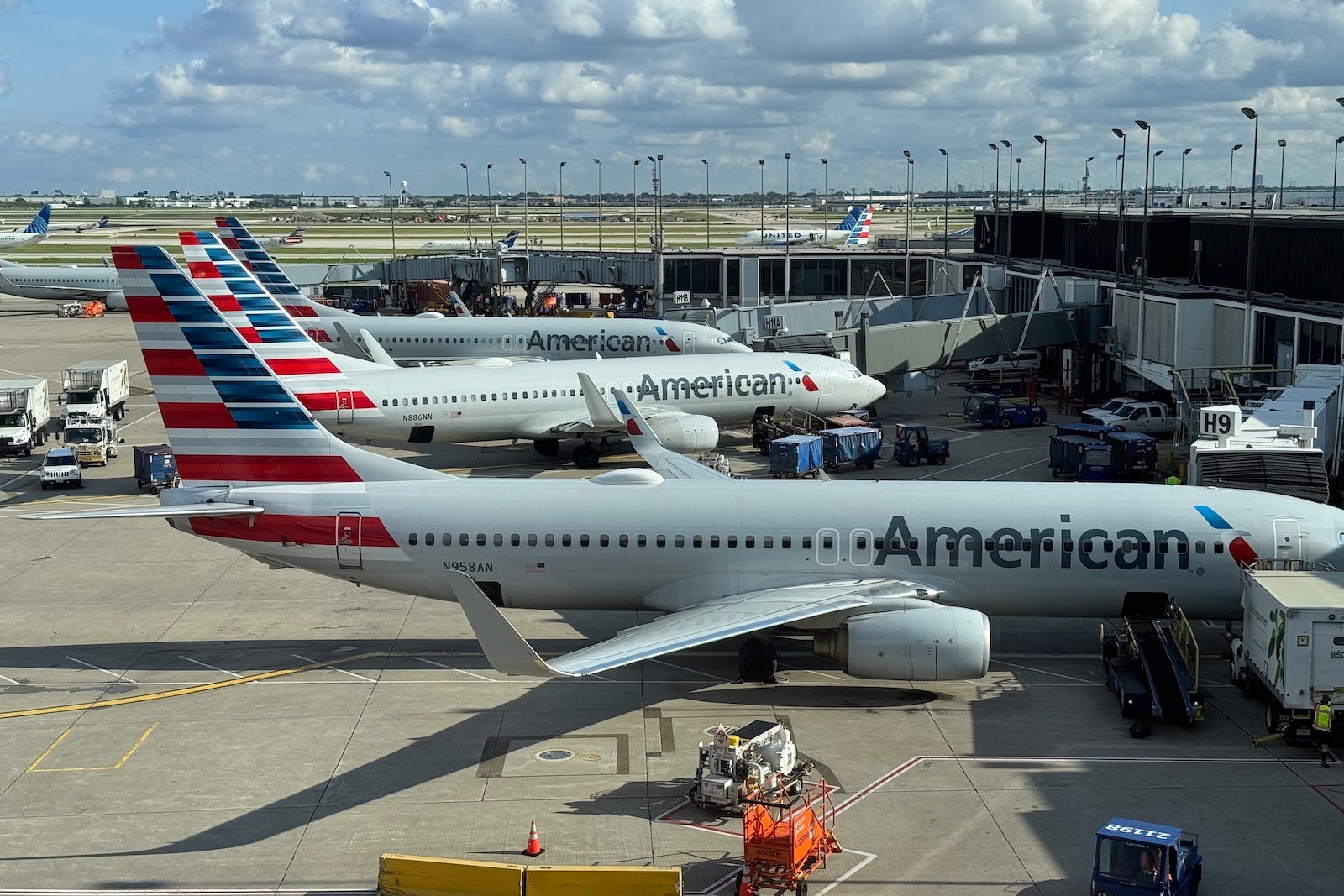 American Airlines planes parked at airport gates