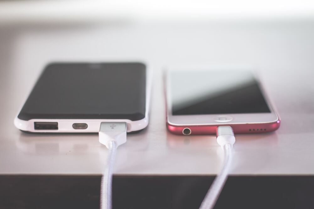 phones charging on desk