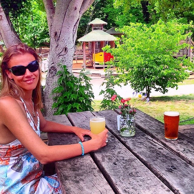 woman drinking pint at bright brewery