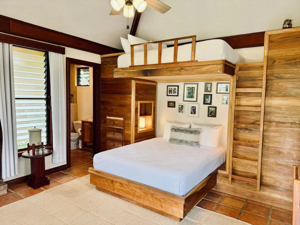 queen bed with twin bunk above it