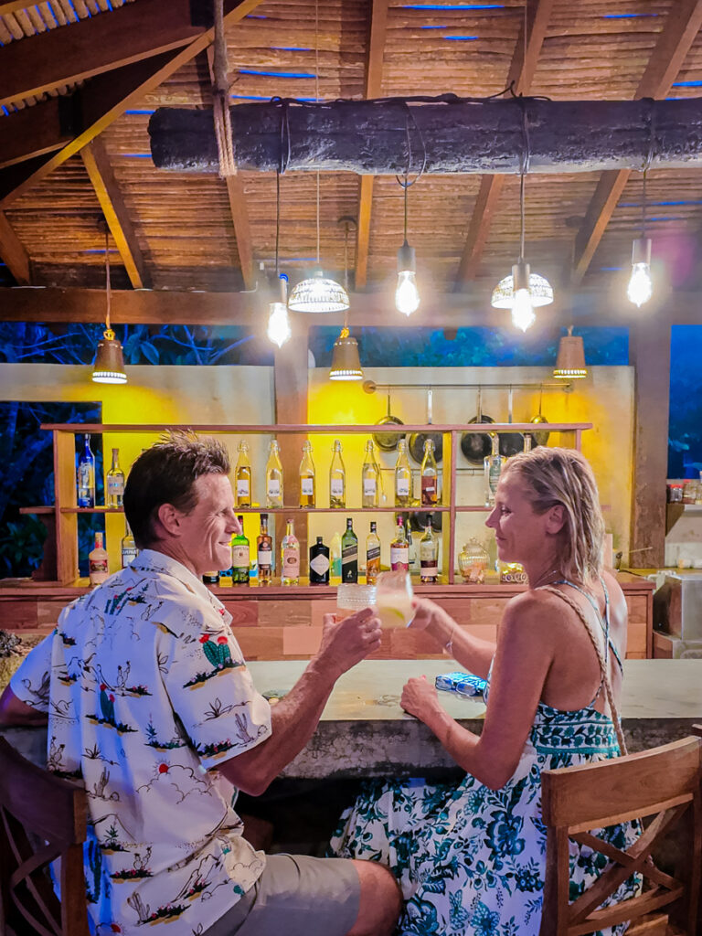 couple at bar with cocktails