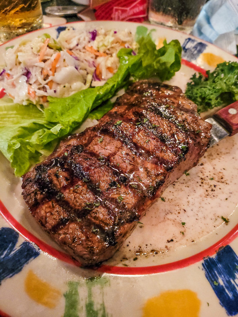 steak and coleslaw on a plate