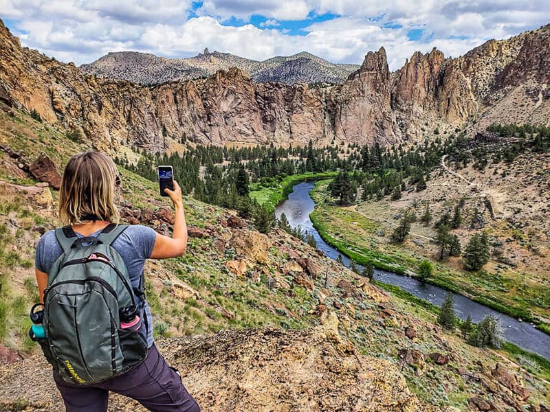 woman taking photo on Misery Ridge Trail, Smith Rock State Park