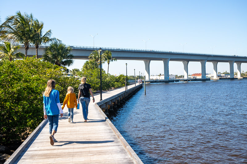 woman and two girls walking along the Lovely boardwalk in Stuart Florida