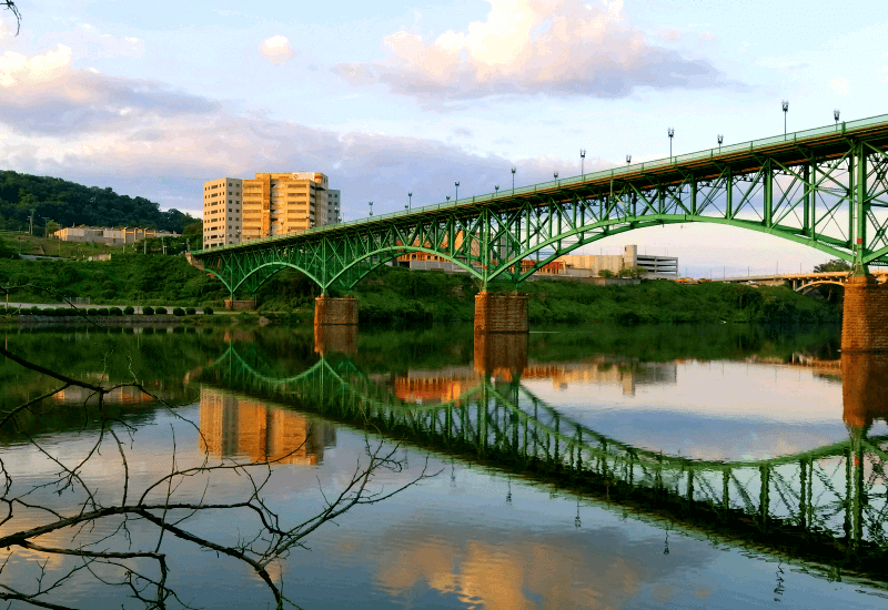 The Tennessee River in Knoxville with bridge across it at sunset