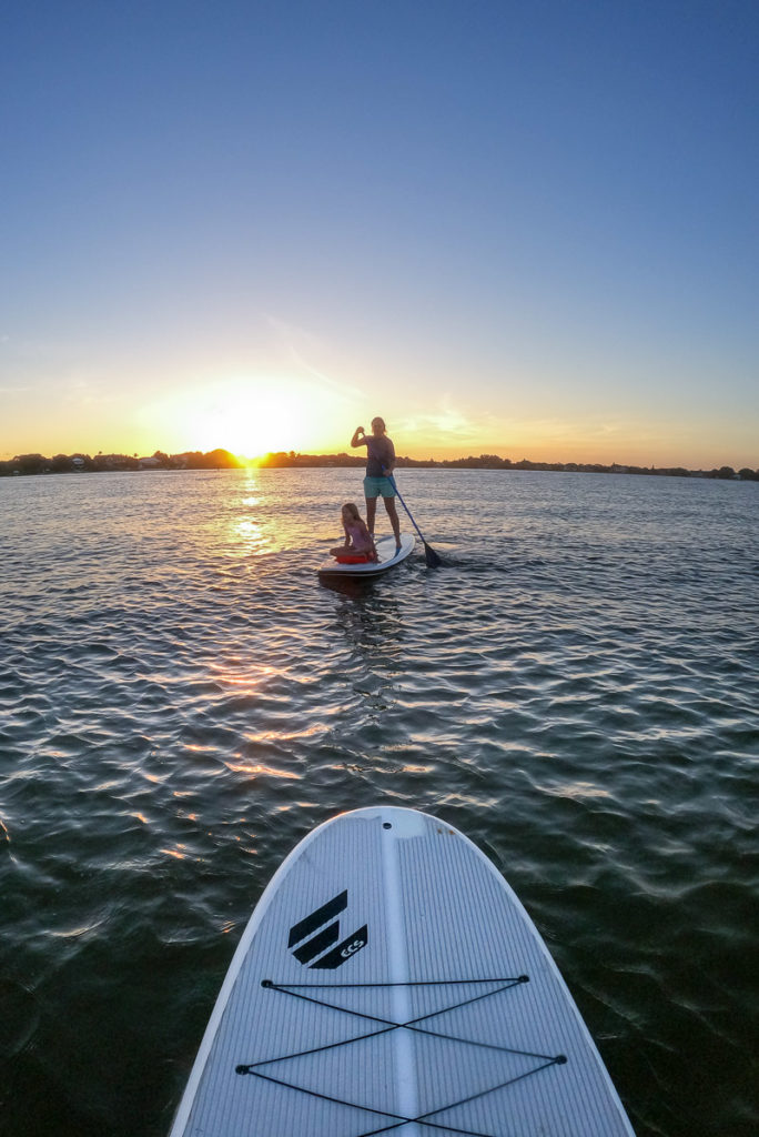 people stand up paddle boarding