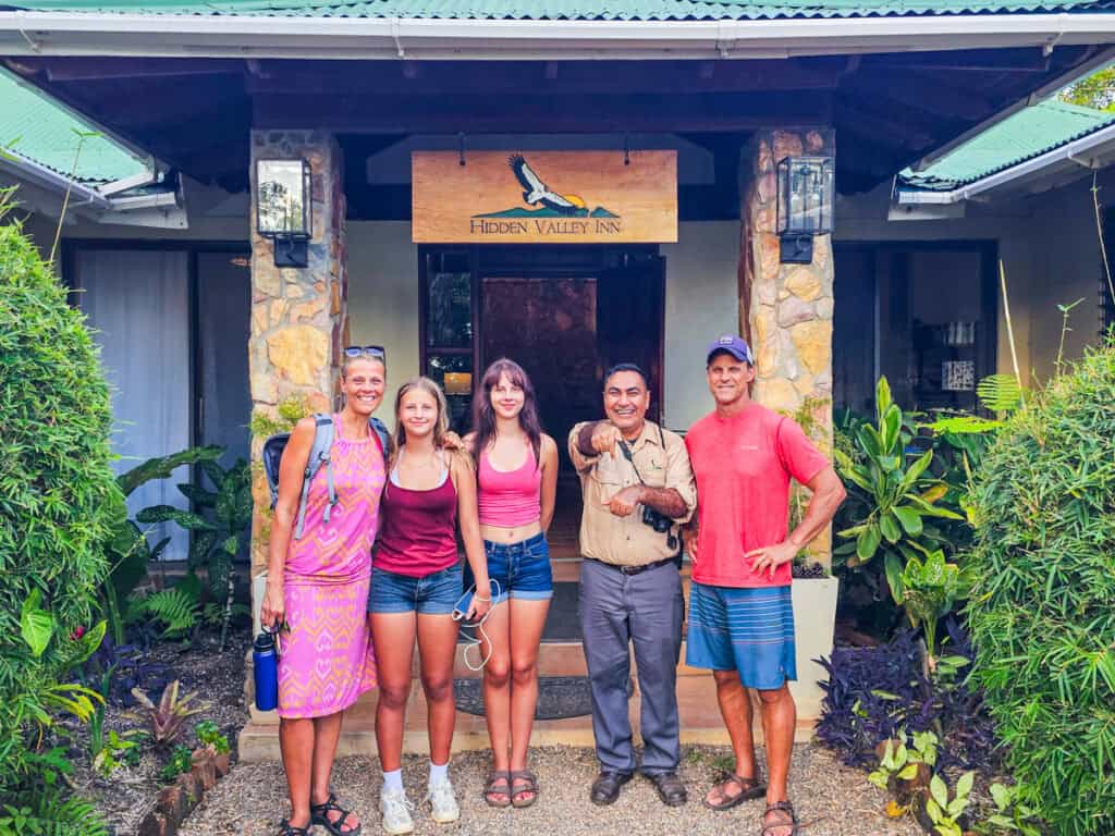 family with marvin the tour guide at hidden valley wilderness lodge entry