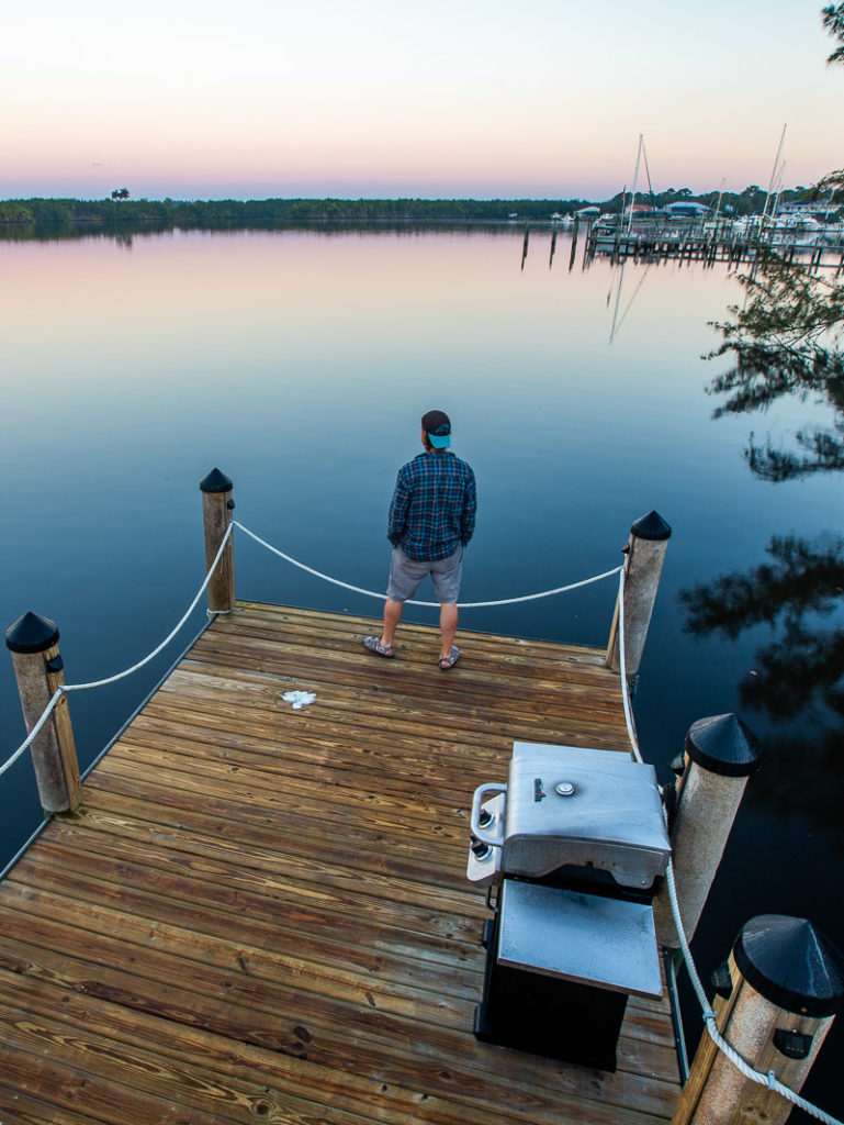 man standing on a pier