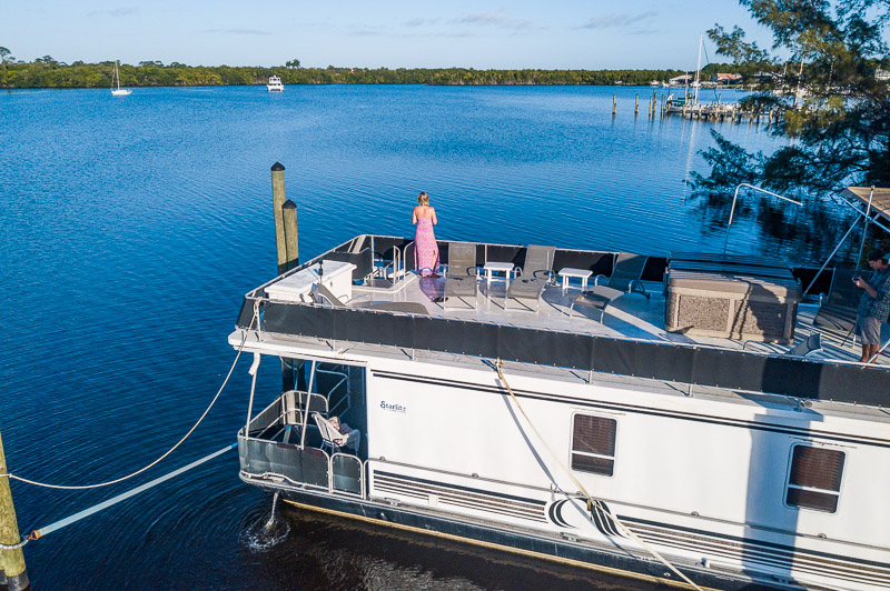 woman standing on houesboat